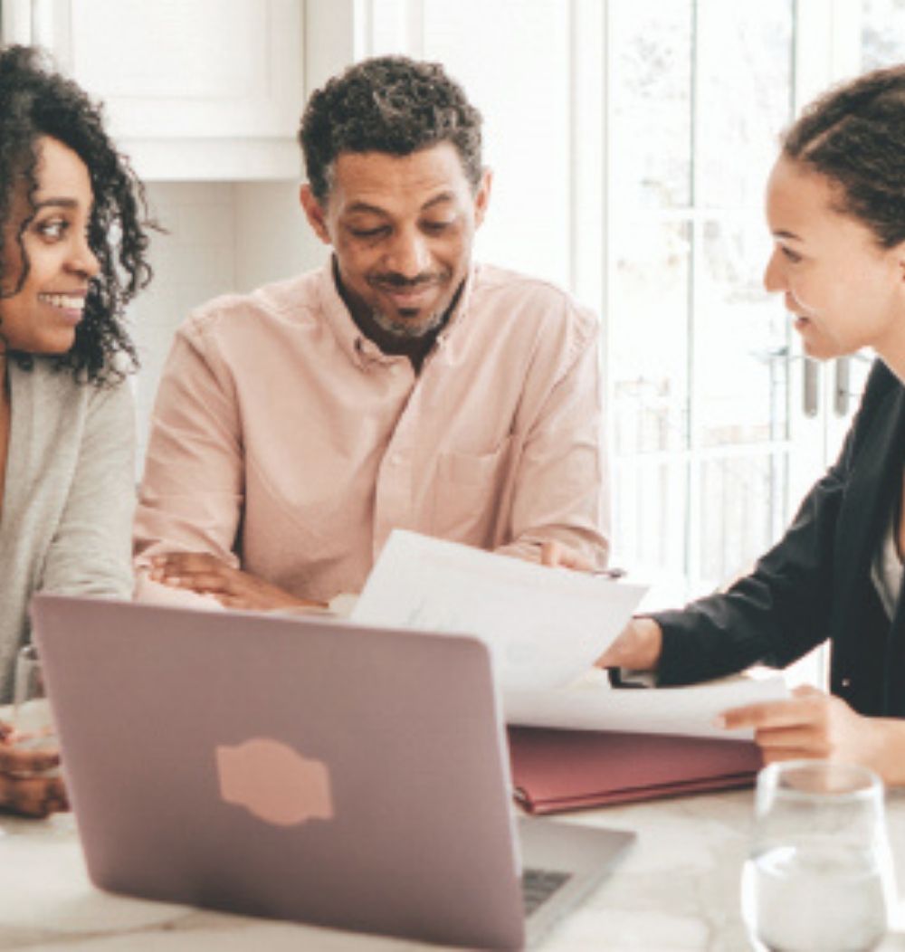 An image of a financial advisor working with a couple.